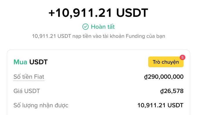 The image shows a completed Binance transaction for purchasing 10,911.21 USDT with 290,000,000 đ (đồng) at a rate of 26,578 đ/USDT, confirming the user successfully added USDT to their Funding account. This receipt verifies the "buying USDT to hold" action mentioned in the post, where the user is stockpiling USDT in advance of Vietnam's upcoming crypto regulations.