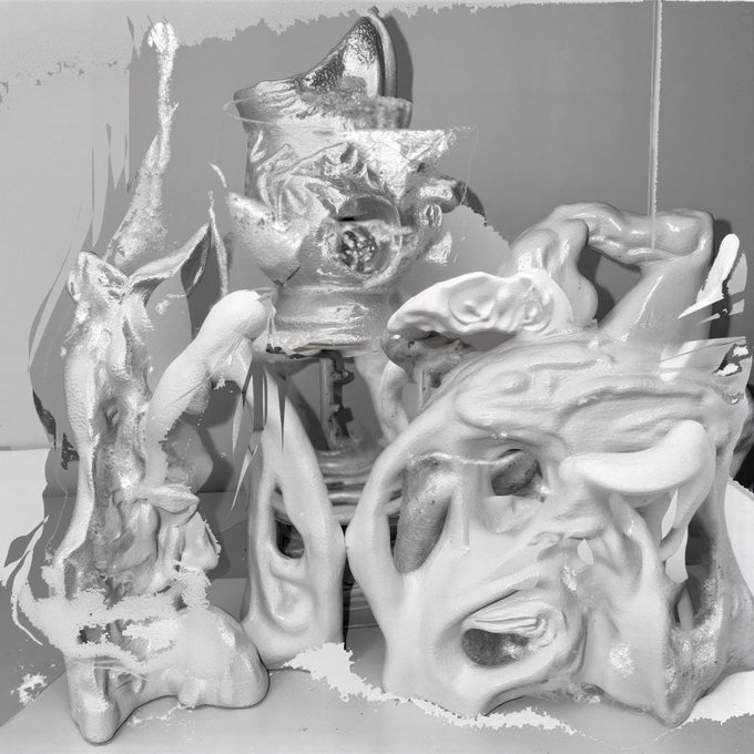 The image features a collection of sculptures, including a large white sculpture with a face and hands, as well as smaller sculptures that appear to be made from various materials such as metal or plastic. The sculptures are arranged in an interesting manner on a table, creating a visually appealing display. The post about GM's infomercials is displayed at the bottom of the image, indicating that it may be related to the sculptures being sold by GM.

The text "so happy to be dropping on @objktcom next week lets goooooo more infos soon" suggests that there might be a sale or promotion happening for these sculptures, and the post is likely meant to inform viewers about this event.