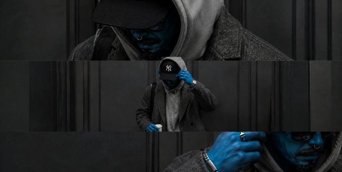 A stylized image showing a person in a cap and hoodie with blue-painted skin and hands, featuring a 'NY' logo cap.