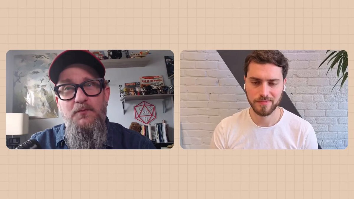 The image shows two men with beards, one wearing glasses and the other wearing a white shirt, having a conversation over a video call using an app like Zoom or Skype. The background of the image features a brick wall, which adds a rustic touch to the scene. There is also a potted plant visible in the background, adding some greenery to the setting. The post about the new app Orbs Mini and its human verification feature seems to be related to this conversation between the two men.