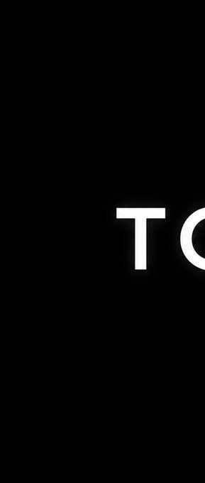 The image shows a black background with the white text "TO" partially visible on the right side, appearing to be cut off or in the process of a transition/animation.