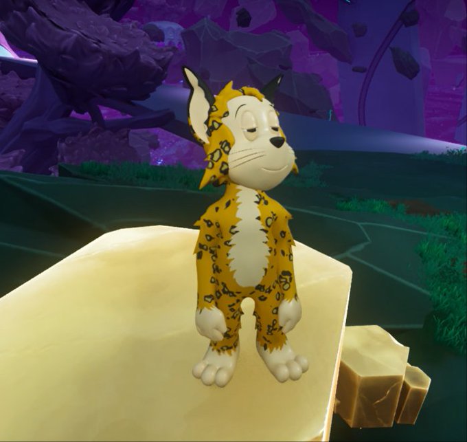 A cartoon-style leopard-like creature with closed eyes standing on a tan rock platform in a purple, otherworldly environment.