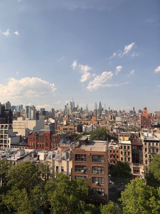 A scenic rooftop view of Manhattan's skyline, with the Empire State Building visible in the distance, frames a sunny day at Solana's NYC headquarters—capturing the cityscape that complements the "Solana summer" vibe.