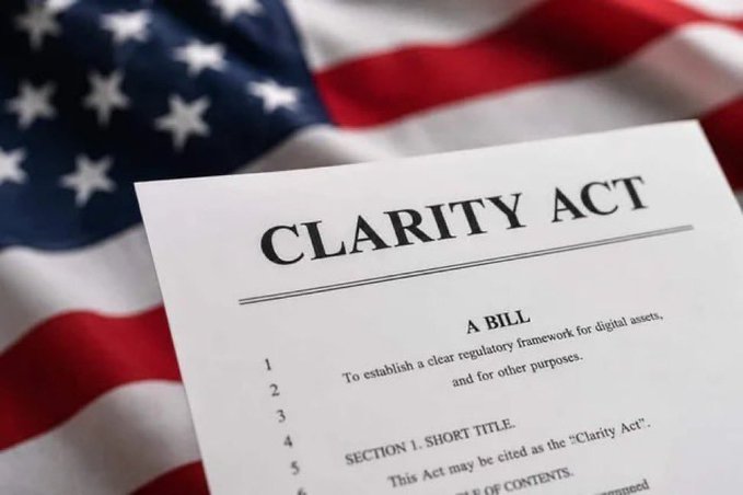A document titled 'CLARITY ACT' with the subtitle 'A BILL' and text reading 'To establish a clear regulatory framework for digital assets, and for other purposes,' rests on an American flag.