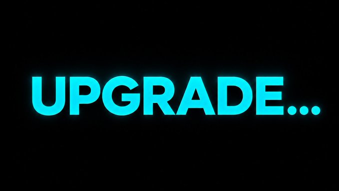 The image features a large, blue neon sign that reads "Upgrade." The word "Upgrade" is written in a bold, capitalized font with three dots at the bottom of each letter. The background of the image is black, which contrasts with the bright blue color of the sign and makes it stand out prominently.