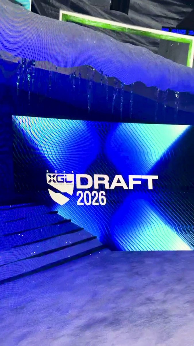 A dramatic blue-lit stage at Cosm Los Angeles with icicle-like decorations displays the "XGL DRAFT 2026" logo on a large screen, signaling the upcoming X Games League Winter Draft event.
