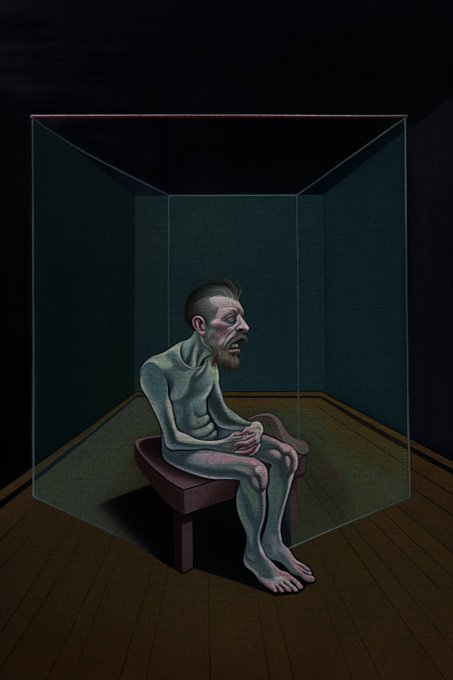 An illustration depicts a gaunt, bearded figure sitting on a small bench inside a transparent glass cube in a dark room.
