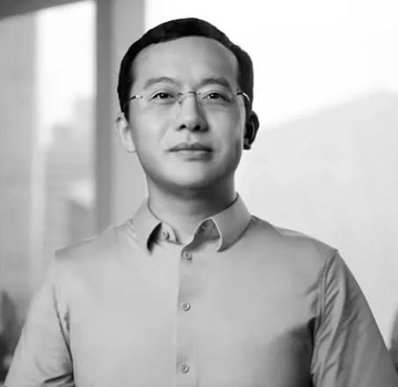 A black-and-white portrait of a man wearing glasses and a button-up shirt, presumably Star Xu, CEO of OKX, who is quoted in the accompanying post about OKX's new AML review process that could restrict crypto deposits from high-risk addresses such as gambling platforms for 15 days or longer.