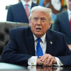 President Donald Trump is shown speaking in what appears to be the Oval Office, wearing a dark suit with a blue striped tie. The image connects to the post's commentary on geopolitical tensions, illustrating the central figure behind the US policy decisions—including the naval blockade and Iran ceasefire rejection—that are driving the current WW3 risk narrative and market volatility.