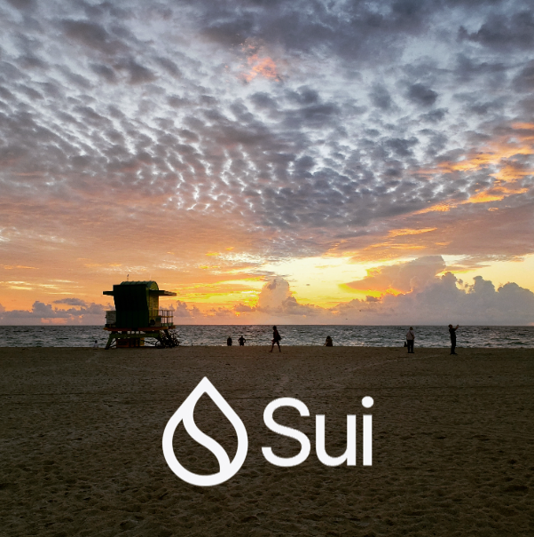 A scenic beach at sunset with a lifeguard tower, people in the distance, and the Sui blockchain logo overlaid in white.
