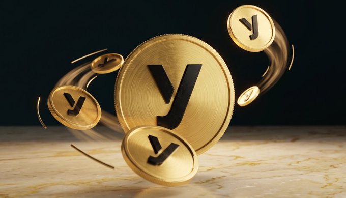 This image features a gold coin with the letter "Y" on it that is surrounded by multiple coins flying through the air. The coins are captured in different positions as they move around the gold coin, creating a dynamic scene of currency movement. The background appears dark, drawing attention to the main elements - the golden coin and the scattered coins - against this backdrop. Above the image, there's text that includes an interesting fact about cryptocurrency transactions, stating "with state channel tech, trades happen instantly off-chain while smart contracts guarantee trustless settlement, no custody, no gas wars, no front running!". This adds context to the scene with its focus on currency and digital transactions.