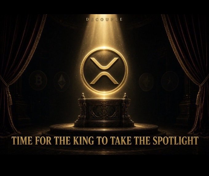 A theatrical, golden-lit stage with curtains parted reveals an ornate pedestal displaying the XRP logo, with the word "DECOUPLE" above and the tagline "TIME FOR THE KING TO TAKE THE SPOTLIGHT" below, symbolizing XRP's breakout moment from Bitcoin's shadow.
