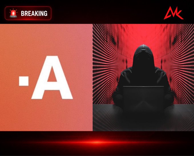 A "BREAKING" news graphic features the text "·A" on a red background alongside a hooded figure using a laptop in a red-tinted digital corridor, symbolizing a cyberattack. The imagery visually reinforces the reported exploit of Triple-A wallets, which has resulted in over $9.7 million in suspicious outflows across multiple blockchains.