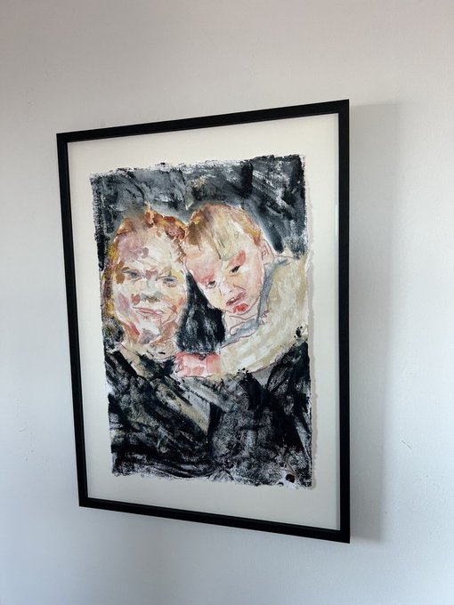 A framed expressionist or impressionist painting of two figures with distorted features hangs on a white wall, rendered in loose, emotional brushstrokes with dark and pale tones.