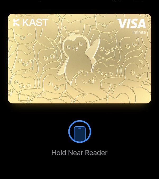 A digital wallet screen showing a gold 'KAST VISA Infinite' credit card with an embossed penguin design, instructing the user to 'Hold Near Reader' below.