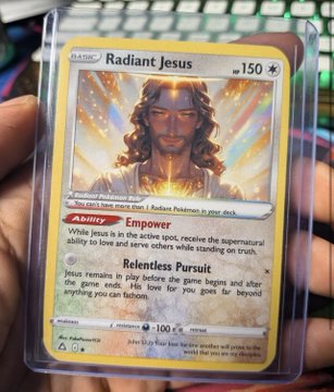 A hand holding a Pokémon trading card titled "Radiant Jesus" — a custom religious-themed card featuring 150 HP, an "Empower" ability, and a "Relentless Pursuit" attack.