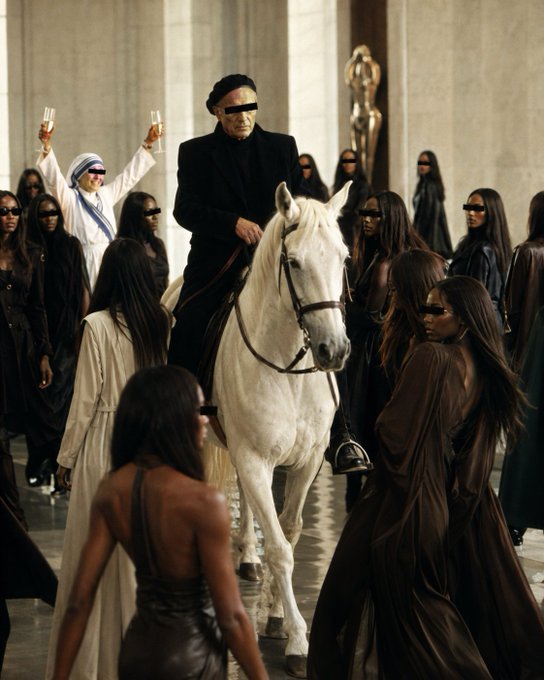A man in black, wearing a blindfold, sits atop a white horse surrounded by a crowd of people—many also blindfolded—in a marble hall, evoking a theatrical, ritualistic atmosphere. The image's dramatic, ceremonial aesthetic aligns with the post's mention of "100% Accidentally Directed. Episode #154," suggesting a fashion show or art performance captured in a single cinematic frame.