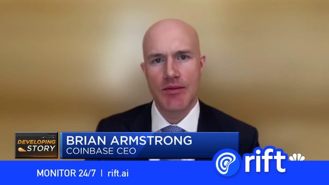 Screenshot from a CNBC 'Developing Story' segment featuring Coinbase CEO Brian Armstrong, with a Rift advertisement banner at the bottom.