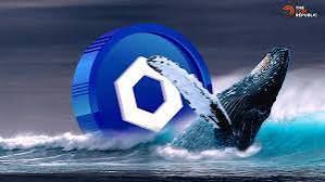 A digital graphic featuring a whale breaching the ocean surface with a large blue hexagon symbol and a small red logo in the top right corner.