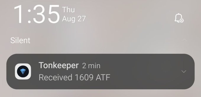 A smartphone lock screen notification showing the time 1:35 on Thursday, August 27, in Silent mode, with a notification from Tonkeeper indicating 'Received 1609 ATF' 2 minutes ago.