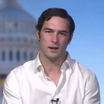 A man in a white dress shirt appears on what seems to be a news broadcast with a domed government building in the background, suggesting he is being interviewed in a political context. The image aligns with the post about Representative Brandon Gill's recent financial disclosures, visually representing the lawmaker mentioned in the caption.