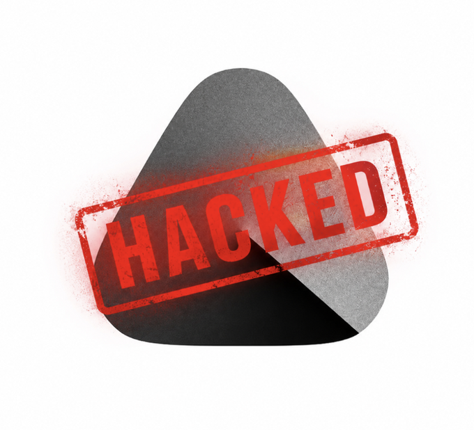 A dark rounded triangular icon overlaid with a distressed red 'HACKED' stamp graphic on a white background.