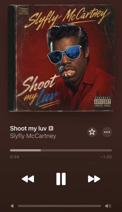 A Spotify music player interface showing the song 'Shoot my luv' by Slyfly McCartney, with album art featuring a man in blue sunglasses and the 'Parental Advisory Explicit Lyrics' label.