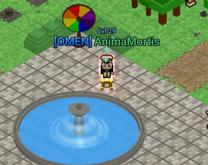 A screenshot from a voxel-based game showing a level 29 character named '[OMEN] AnimaMortis' standing near a blue fountain with a colorful spinning wheel sign overhead.