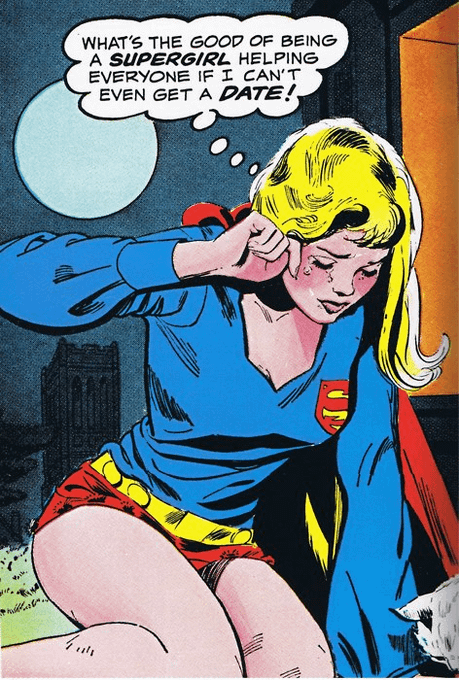 In this image, there's an illustration of a woman wearing a blue shirt with a red cape and shorts, sitting down while holding her head up high. She has blonde hair and is looking at something above her head. The background features a city skyline or buildings, which adds to the urban atmosphere of the scene. 

The caption below the image reads: "What's the good of being a superhero? Helping everyone even get a date!". This phrase seems to be a reference to the comic strip "Supergirl" by Alan Moore and is meant to convey the idea that superheroes are always ready to help others, regardless of their personal lives or relationships.