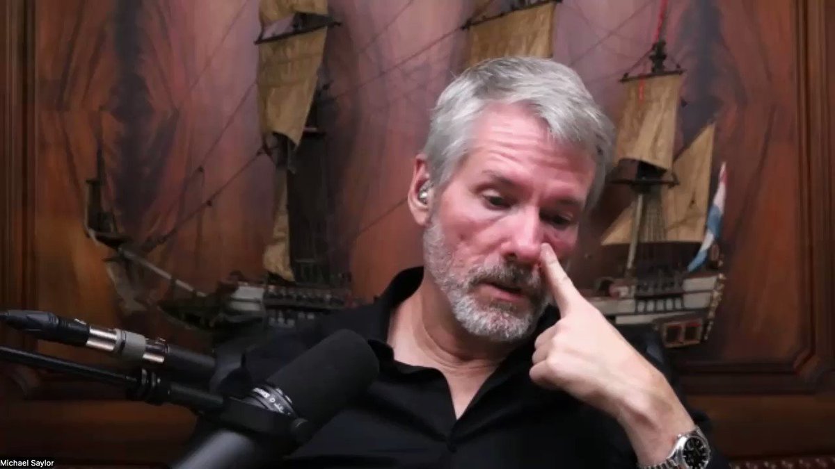 The image shows a man with a beard wearing glasses sitting at a microphone, holding his nose up as if he's sniffing or sneezing. The background features a painting of ships, which could be interpreted as a representation of the economy or financial markets. The caption above the image reads "BITCOIN IS HOPE" and "focus on what is in the image & how it relates to the post", suggesting that Bitcoin has been seen as a potential solution for economic challenges.

The man's facial expression, along with the presence of the ships painting, could be interpreted as an attempt to convey a message about the current state of the economy or financial markets and the potential benefits of Bitcoin as a currency alternative. The caption above the image further emphasizes this message by stating that Bitcoin is better than a union and will never die.