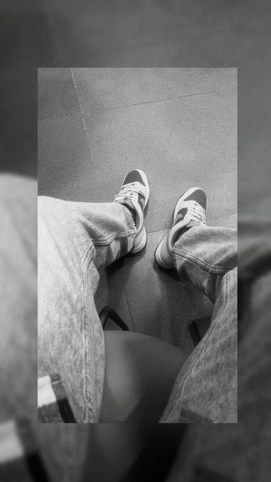 A black-and-white first-person shot shows a pair of Nike sneakers and baggy denim jeans against a tiled floor, reflecting the grounded, "ready to go" energy of the post about markets opening and building.