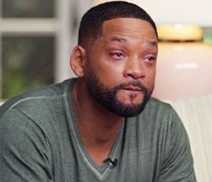 A close-up of Will Smith looking emotional during what appears to be an interview.