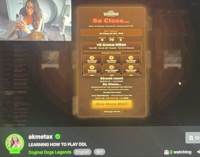 A live stream by akmetax titled 'LEARNING HOW TO PLAY DDL' featuring the game Doginal Dogs Legends, showing a 'So Close...' game over screen with arena miles stats.