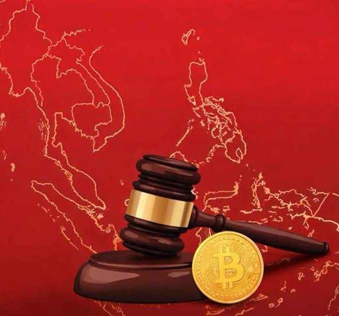 A wooden gavel rests beside a gold Bitcoin coin against a red background featuring an outlined map of Southeast Asia, symbolizing the intersection of legal authority and cryptocurrency in the region. The image visually represents Vietnam's newly enforced crypto regulations highlighted in the post, emphasizing regulatory oversight over exchanges, mandatory identity verification, and anti-money laundering compliance.