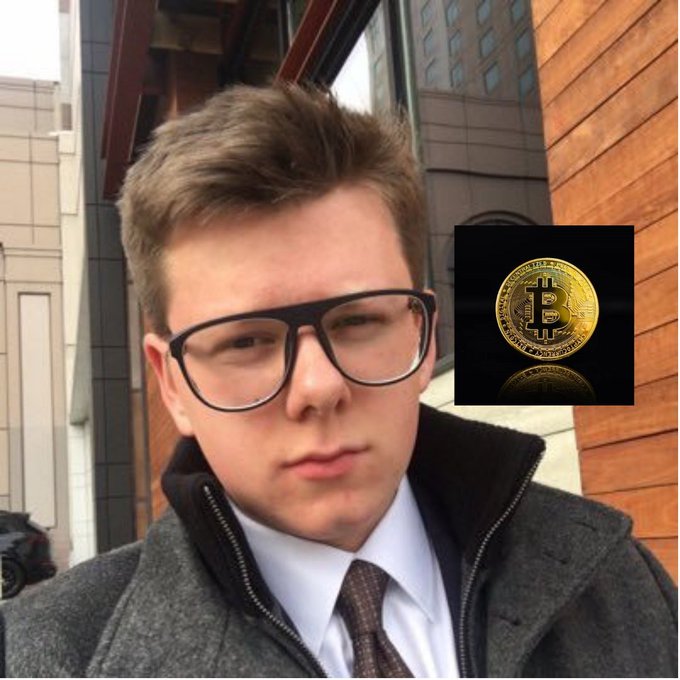 A young man in glasses, a white shirt, and dark tie poses in front of a building, with a Bitcoin logo overlaid beside him, illustrating Eric Finman's story as the youngest Bitcoin millionaire.