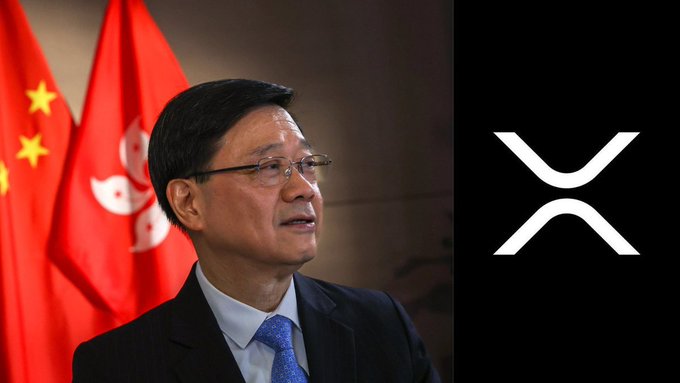 The image shows a man in a suit standing in front of Chinese and Hong Kong flags, alongside the XRP logo, illustrating Hong Kong's new 0% capital gains tax policy on XRP cryptocurrency.