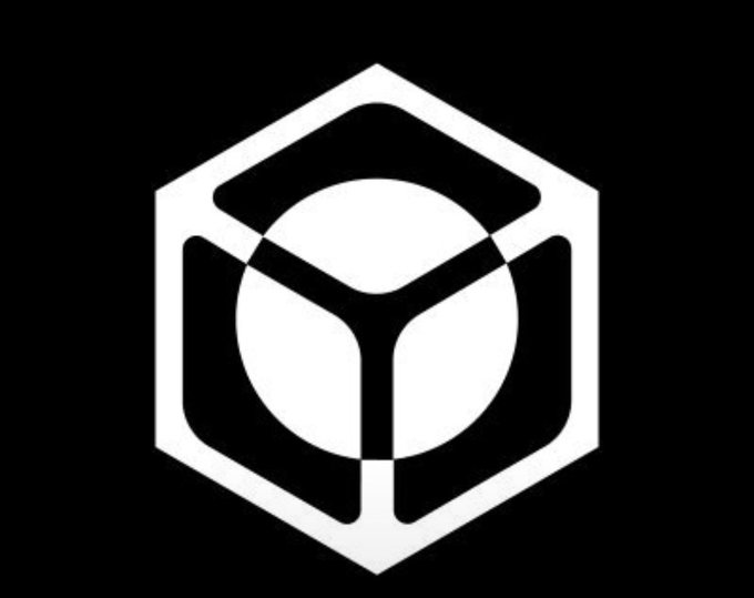 A minimalist white geometric logo featuring a stylized cube or hexagonal shape with a central circular element on a black background.