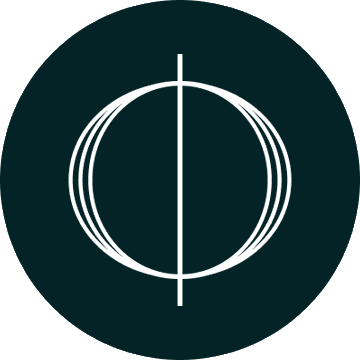 A dark green rounded icon displays a white circular emblem with a vertical line through its center, resembling Cardano's "ø" logo. The minimalist design visually reinforces the post about Charles Hoskinson's commentary on Cardano's RealFi launch.