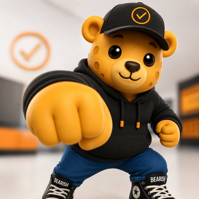 A cartoon bear mascot wearing a black hoodie, cap with a checkmark logo, and sneakers labeled "BEARISH" throws a punch toward the camera, with a matching checkmark logo visible in the background—fittingly illustrating the bullish excitement around "BEARISH" with a playful, fist-forward stance suggesting something big is being "cooked up."