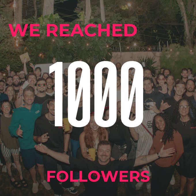 A large group of people pose together at night celebrating a milestone, with bold pink and white text overlay reading "WE REACHED 1000 FOLLOWERS".