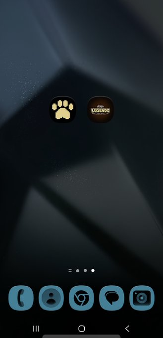A smartphone home screen displays two app icons labeled "DOGINALS" with a paw print logo and "LEGENDS" with "DOGE" text, positioned above the phone's dock. The image aligns with the post by showing $DOGINALS and $DDLTCG featured as app shortcuts, reinforcing the call-to-action to download them on the home screen.