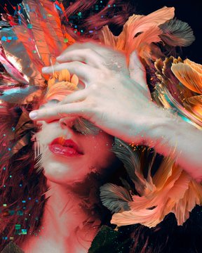 An artistic portrait of a woman with her hand over her eyes, surrounded by vibrant orange and pink feather-like textures and digital glitch effects.