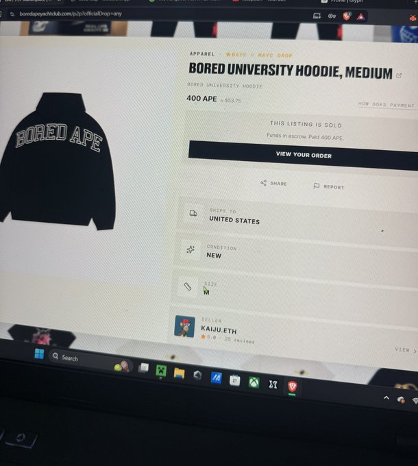 A laptop screen displays a sold listing on a Bored Ape merchandise site for a "Bored University Hoodie, Medium" priced at 400 APE ($53.75), sold by user "KaijuEth" to KaijuTheApe, supporting the claim of being a loyal customer.