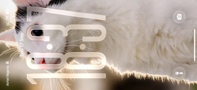 A lock screen image displaying the time '10:01' over a close-up photo of a white cat with heterochromia (one blue eye, one appears darker), dated 'THU 17 Sep' with carrier 'Airtel Nigeria'.