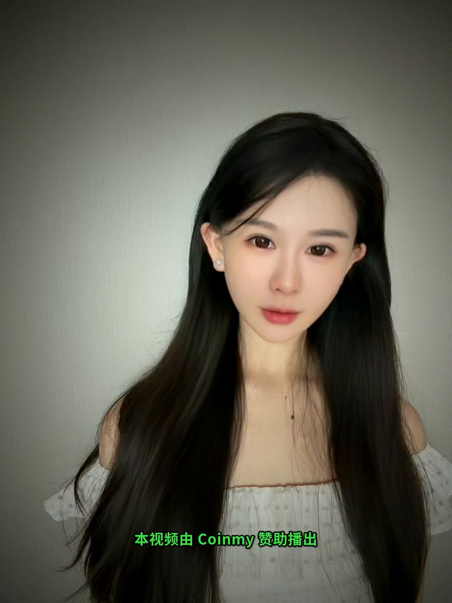 The image features a woman with long black hair wearing a white top, posing for a picture against a gray background. The photo has been edited to include Chinese text that reads "交易所真正的对手", which translates to "CoinMy" in English. This suggests that the image might be related to a post about CoinMy or another cryptocurrency, as it uses a foreign language for its content.