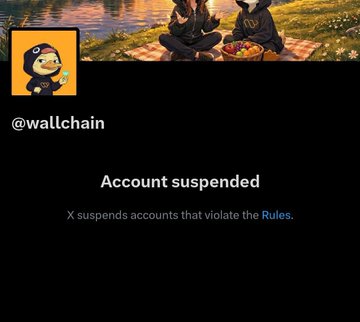 The image features a black background with white text that reads "Account suspended". There are two people sitting at a picnic table, which has a basket of fruit on top. The text also mentions that there have been X suspenders issued by WallChain.