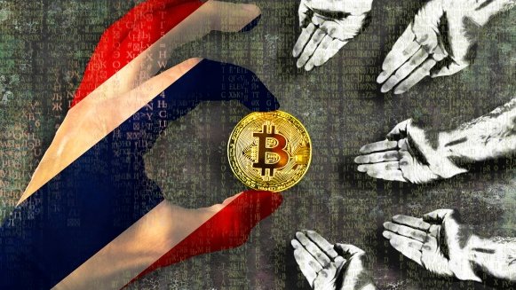 A hand reaching toward a gold Bitcoin coin floating above multiple open hands, set against a textured background with Thai flag elements on the left.