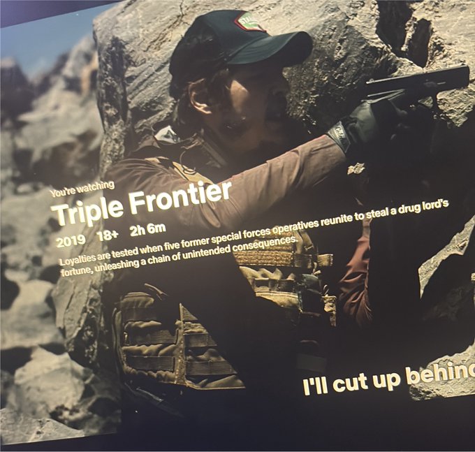 A movie streaming screen showing the title 'Triple Frontier' (2019, 18+, 2h 6m) with a description about former special forces operatives, featuring a man with a rifle and tactical gear.