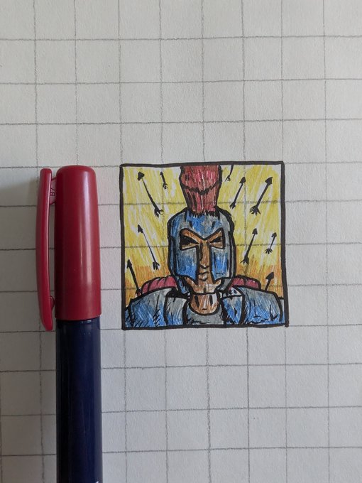 A small marker drawing on graph paper depicting a blue-armored warrior figure with a red plume helmet against a yellow background with arrows, shown next to a red and blue pen for scale.
