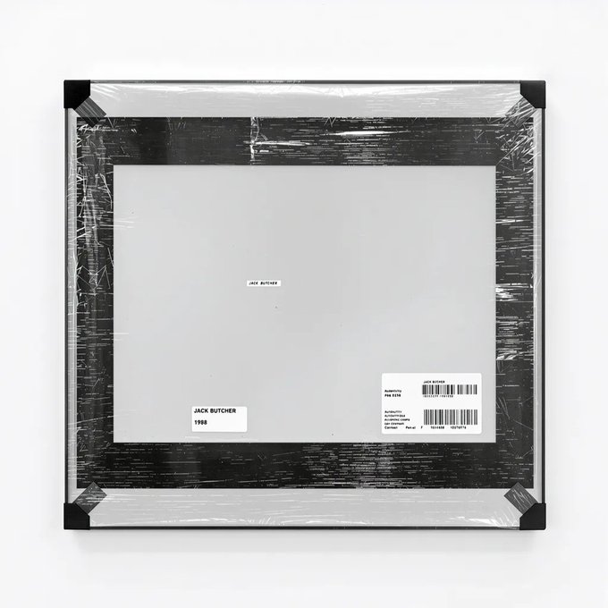 The back of a shrink-wrapped framed print is labeled "JACK BUTCHER, 1998," corresponding to acquisition #140 from artist Jack Butcher's "Perspective" collection as referenced in the post. The shipping label and certification tag are visible, consistent with a recently acquired piece of generative NFT artwork now stored as physical hardware.